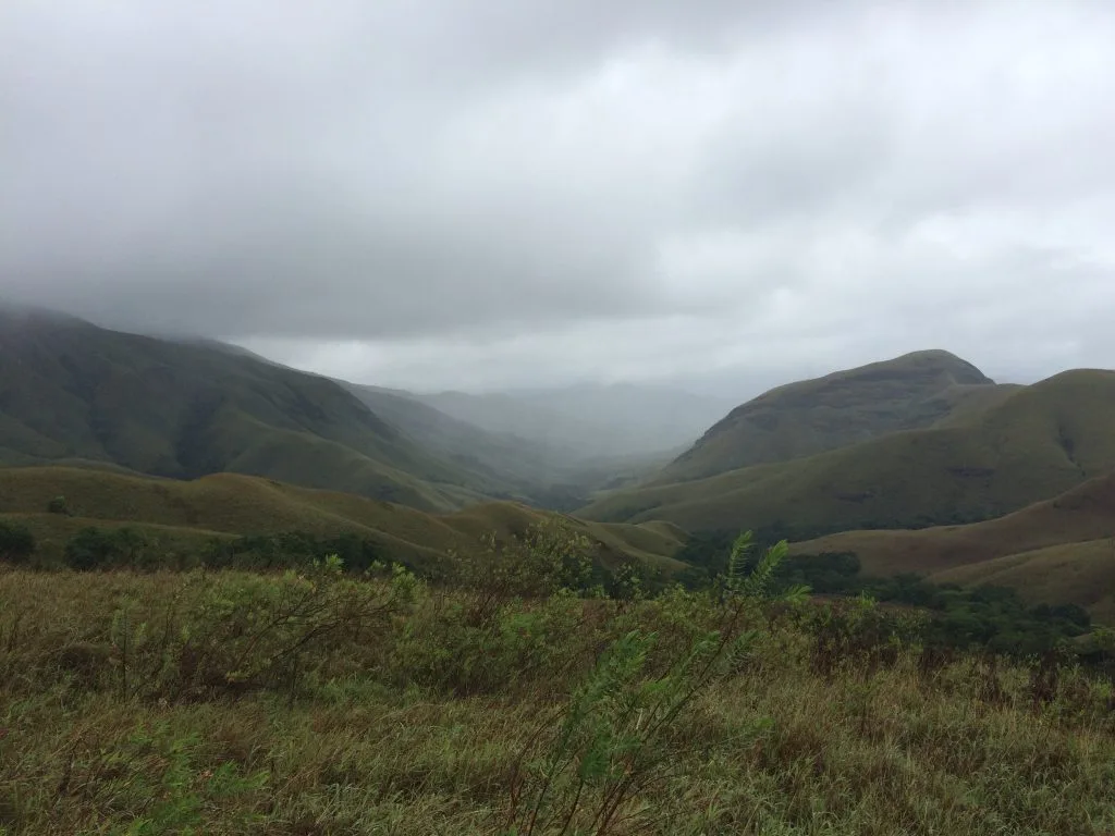Rolling green hills kissing the clouds
